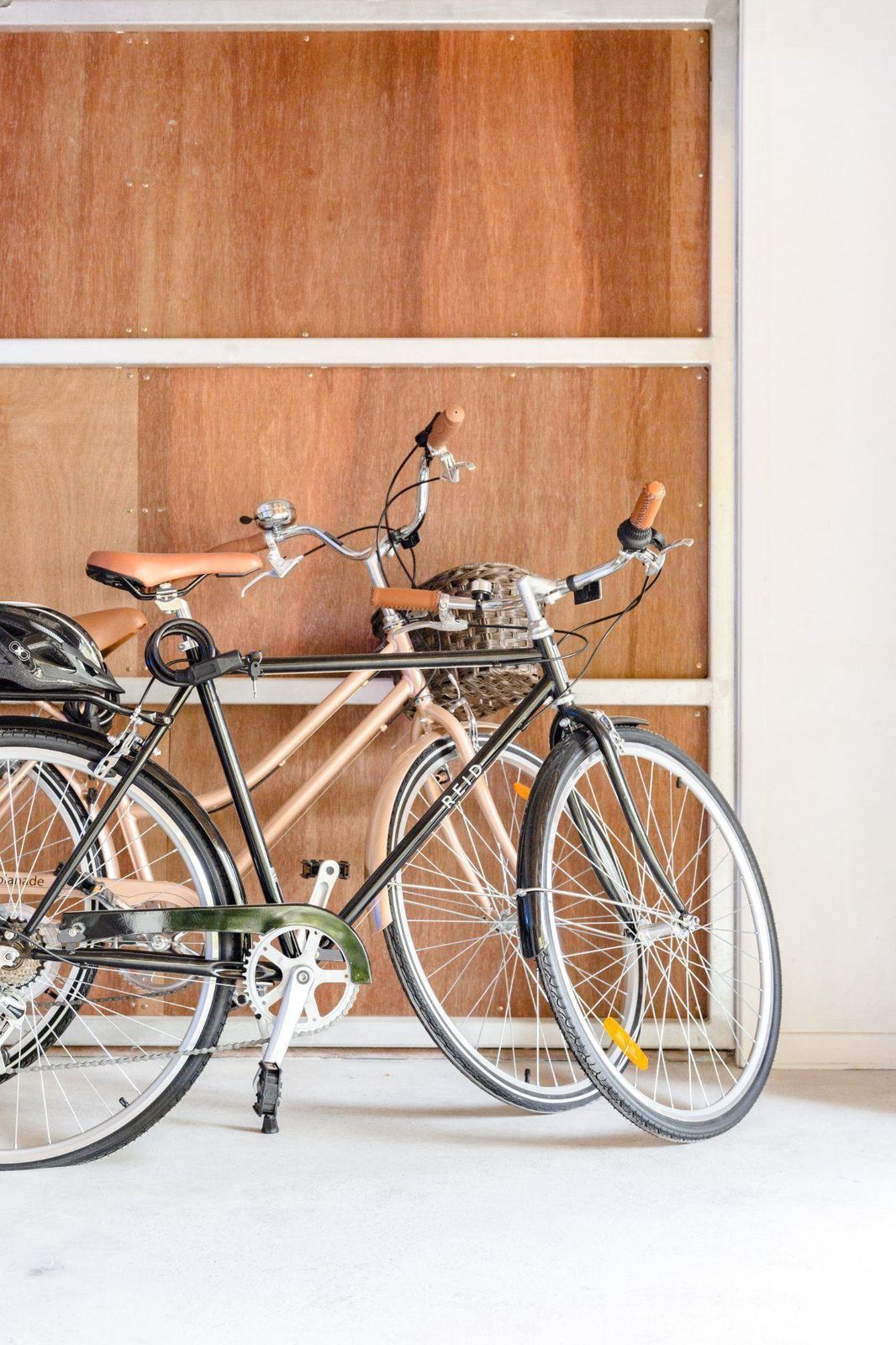 Two bicycles parked beside the entry at LUXE Noosa Hill