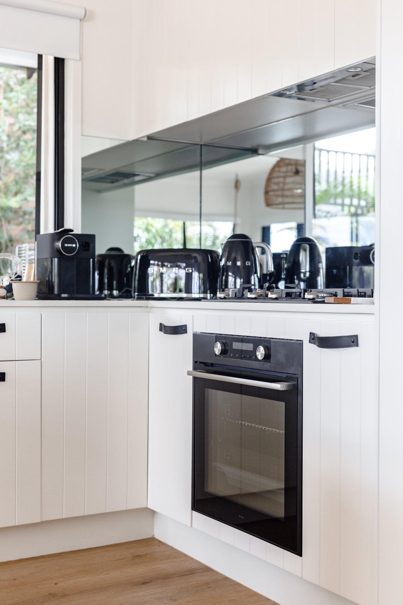 Bright kitchen with island bench at LUXE Noosa Hill