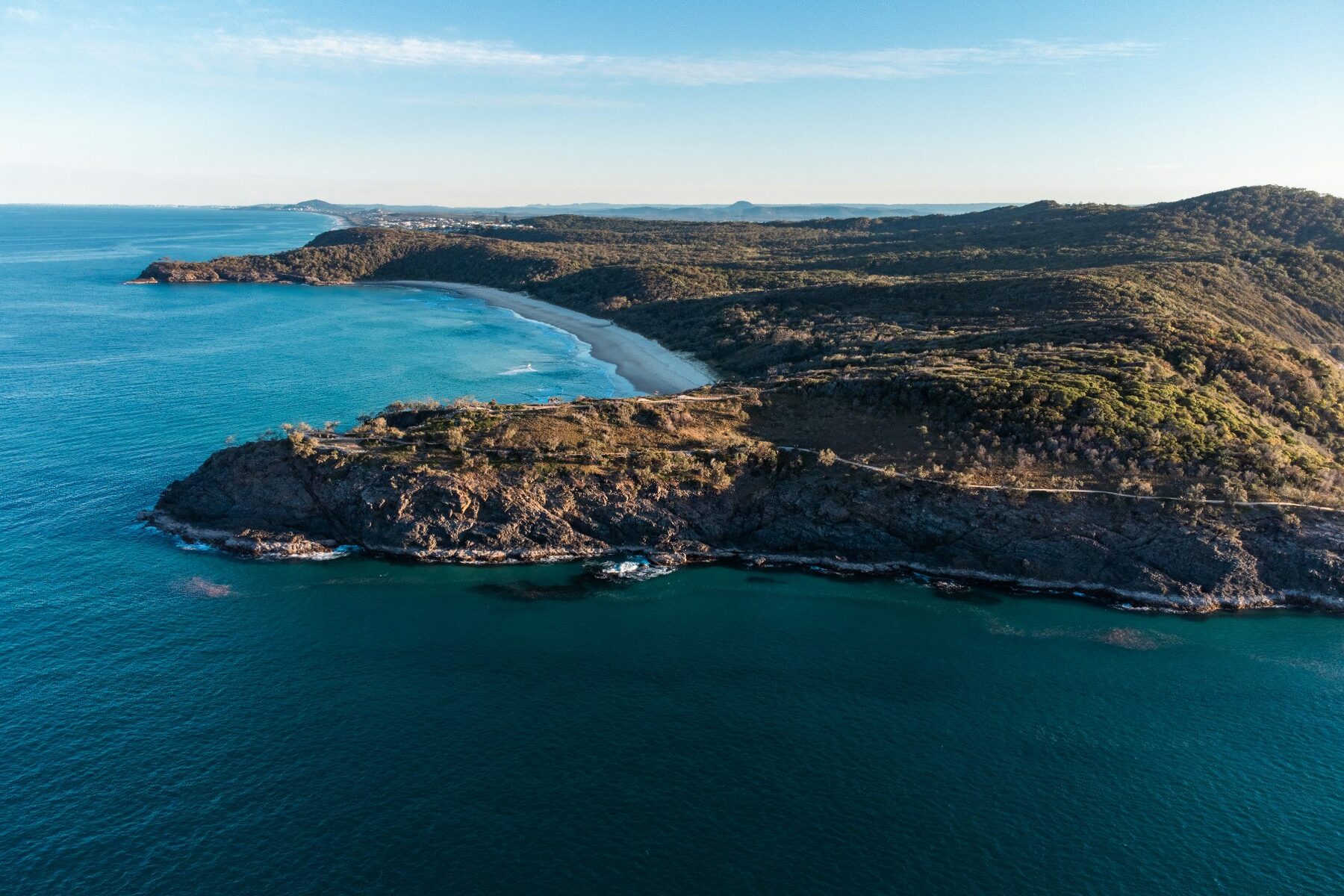 Aerial view across the Noosa National Park headland and coastline